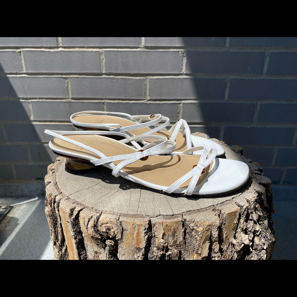 Stuart Weitzman white leather sandals.
